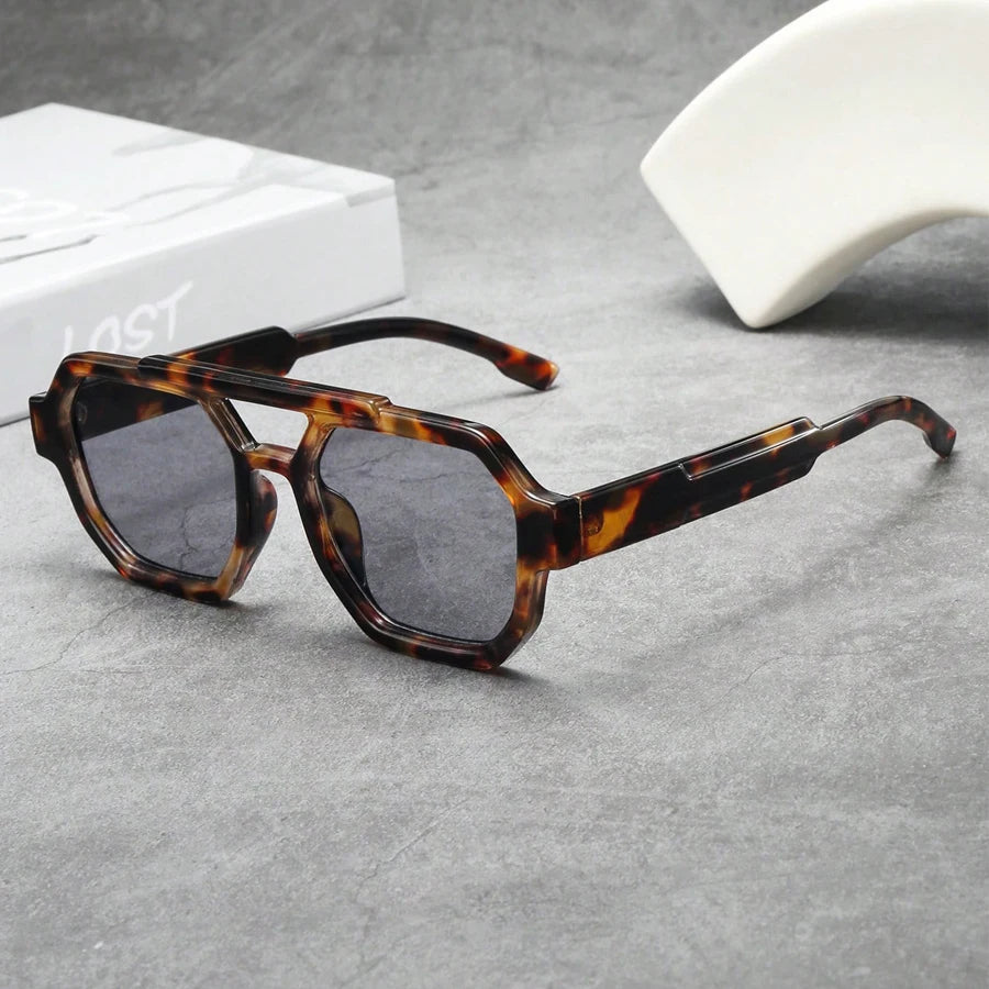 Tortoiseshell oversized hexagonal acetate sunglasses with bold geometric frames and UV protection