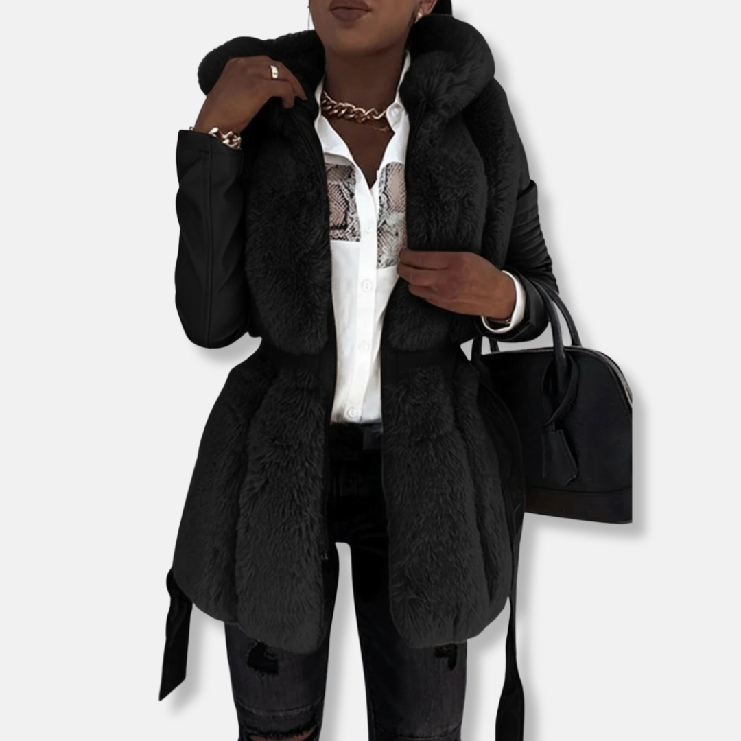Women's black tailored faux leather jacket with faux fur collar, quilted sleeves, and belted waist