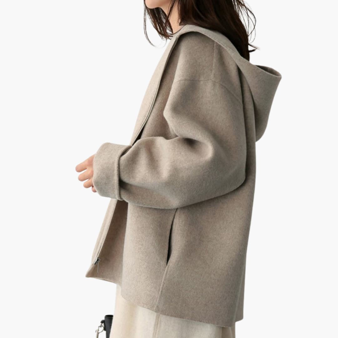 Women's hooded zip-up jacket with seam-integrated pockets, casual everyday style in neutral tone