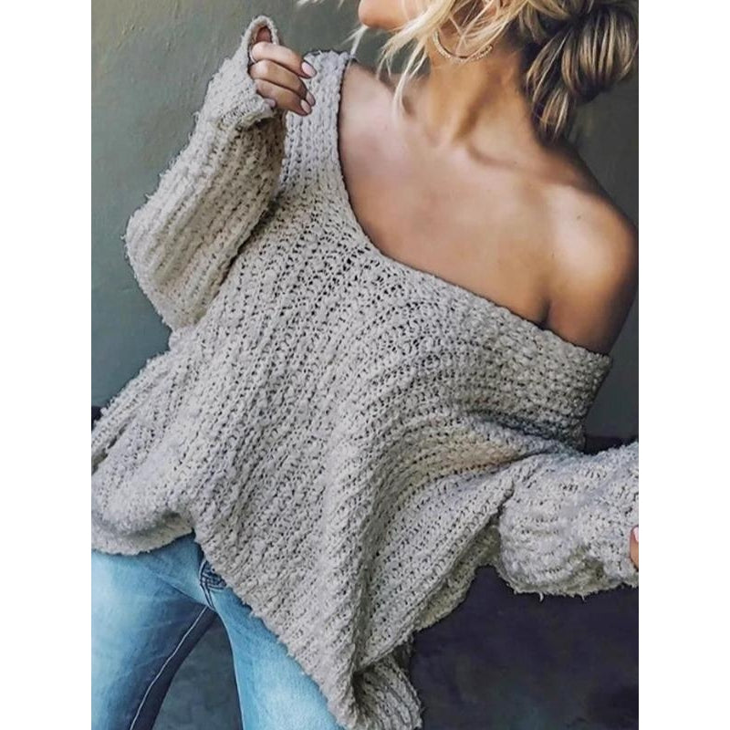 Women's relaxed drop-shoulder knit sweater in soft textured fabric with draped silhouette