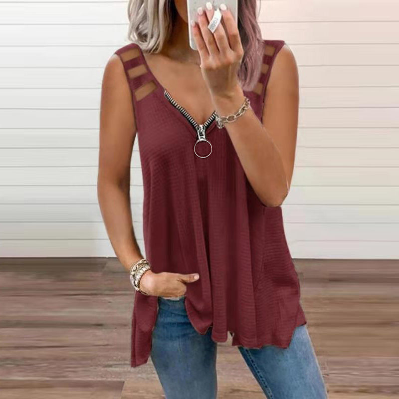 Women's bold red sleeveless blouse with shoulder cutouts and crossed straps for modern casual style