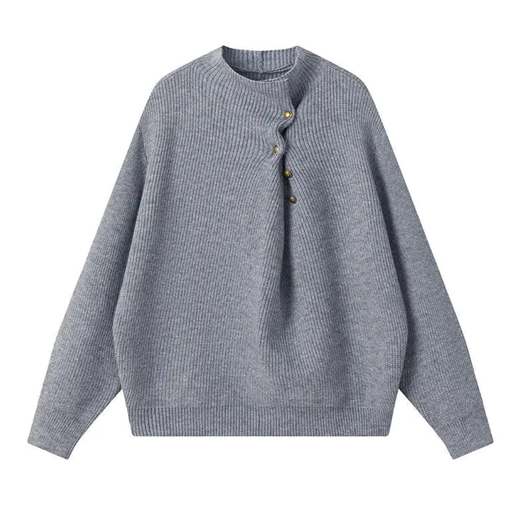 Women's loose fit knitted sweater with offset button line in neutral tones, modern directional design