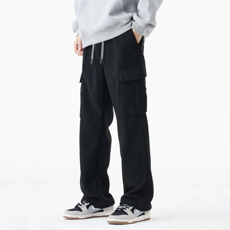 Men's brown corduroy fleece-lined pants with multi-pocket design for outdoor cold-weather wear