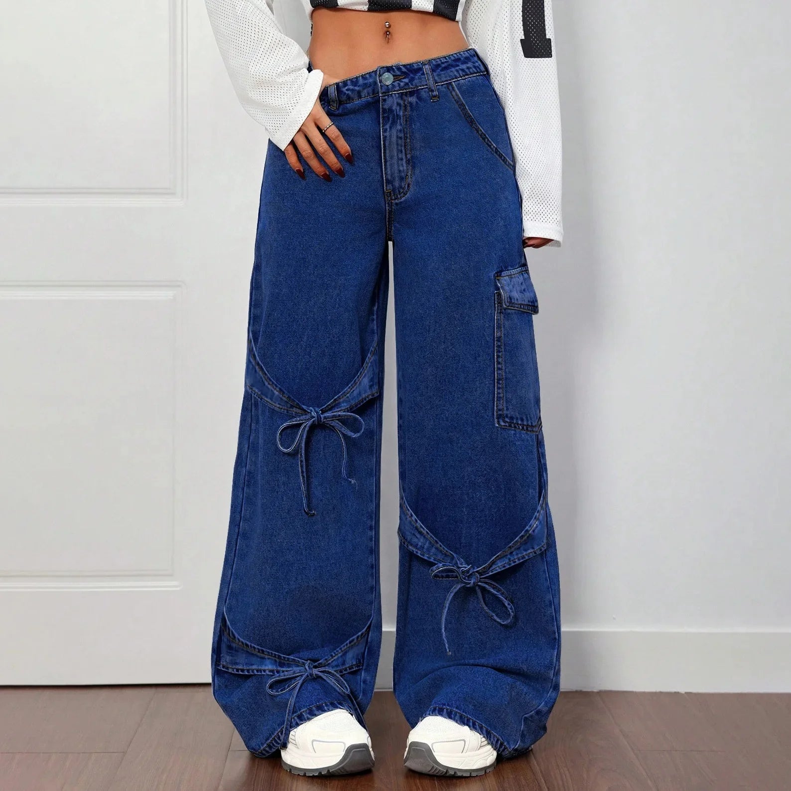 Women's wide-leg faded denim jeans high-waisted silhouette with bold bow-tie side detail