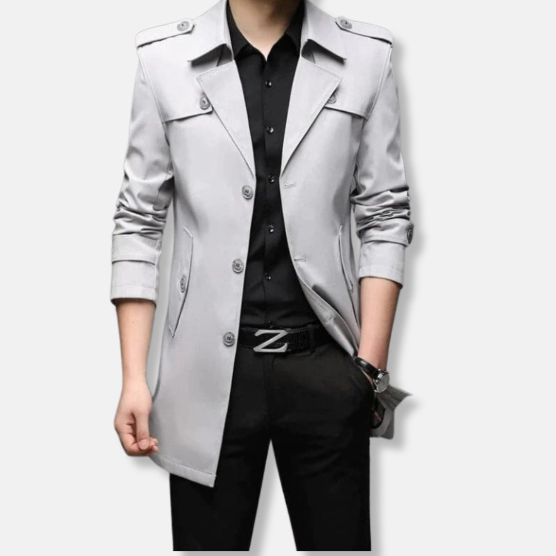 Men's slim fit thigh-length trench coat with button front, epaulets, and storm flaps