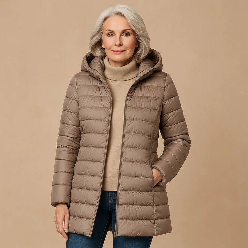 Women's slim-fit lightweight down jacket in neutral tone with insulated hood for cold-weather warmth