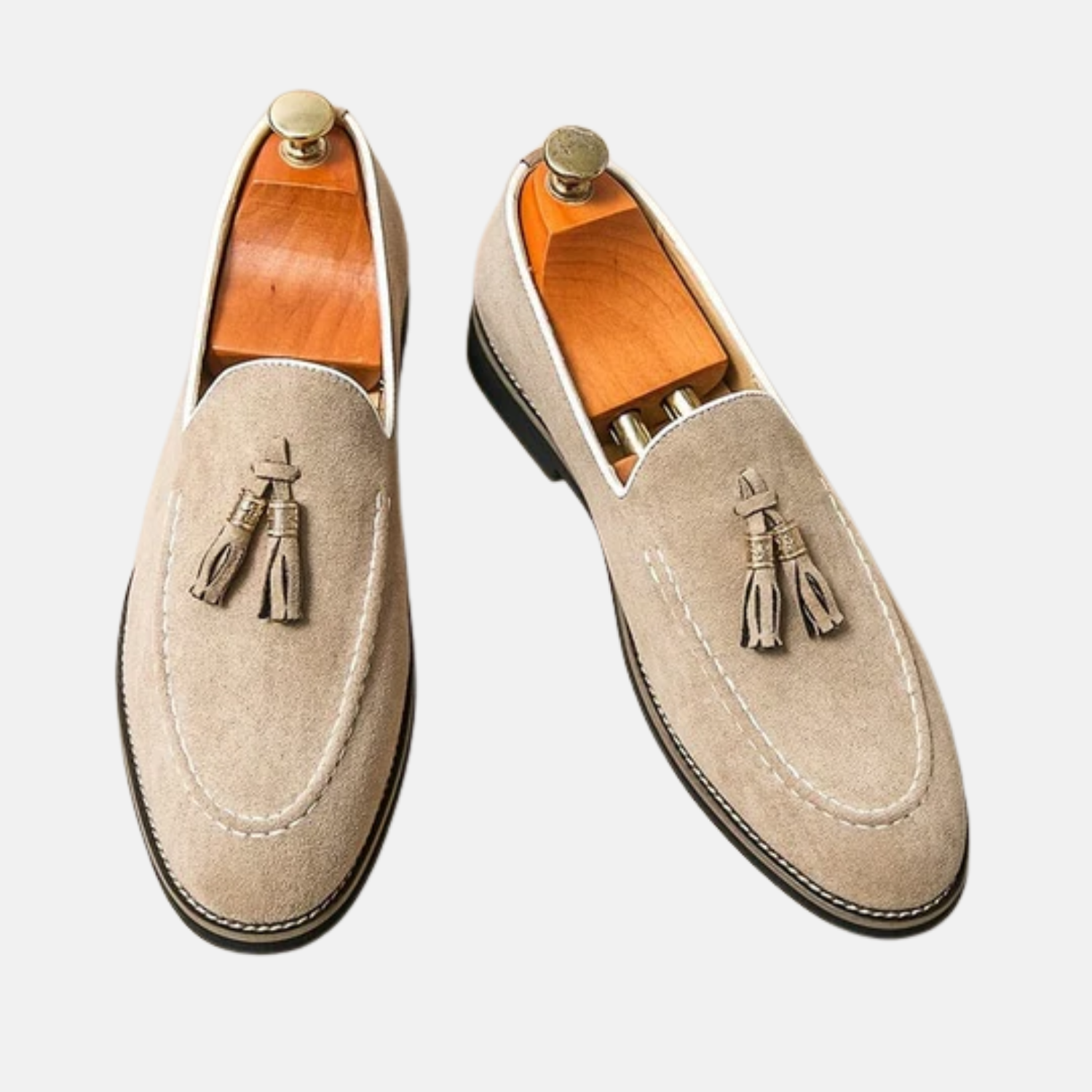 Men's brown suede tassel loafers with hand-stitched detailing, slip-on elegant smart-casual style