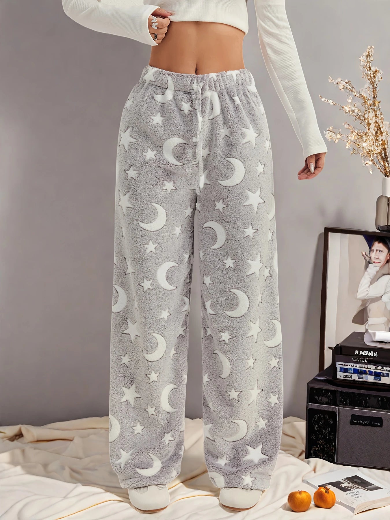 Navy blue wide-leg fleece lounge pants with moon-and-star celestial print for cozy nights