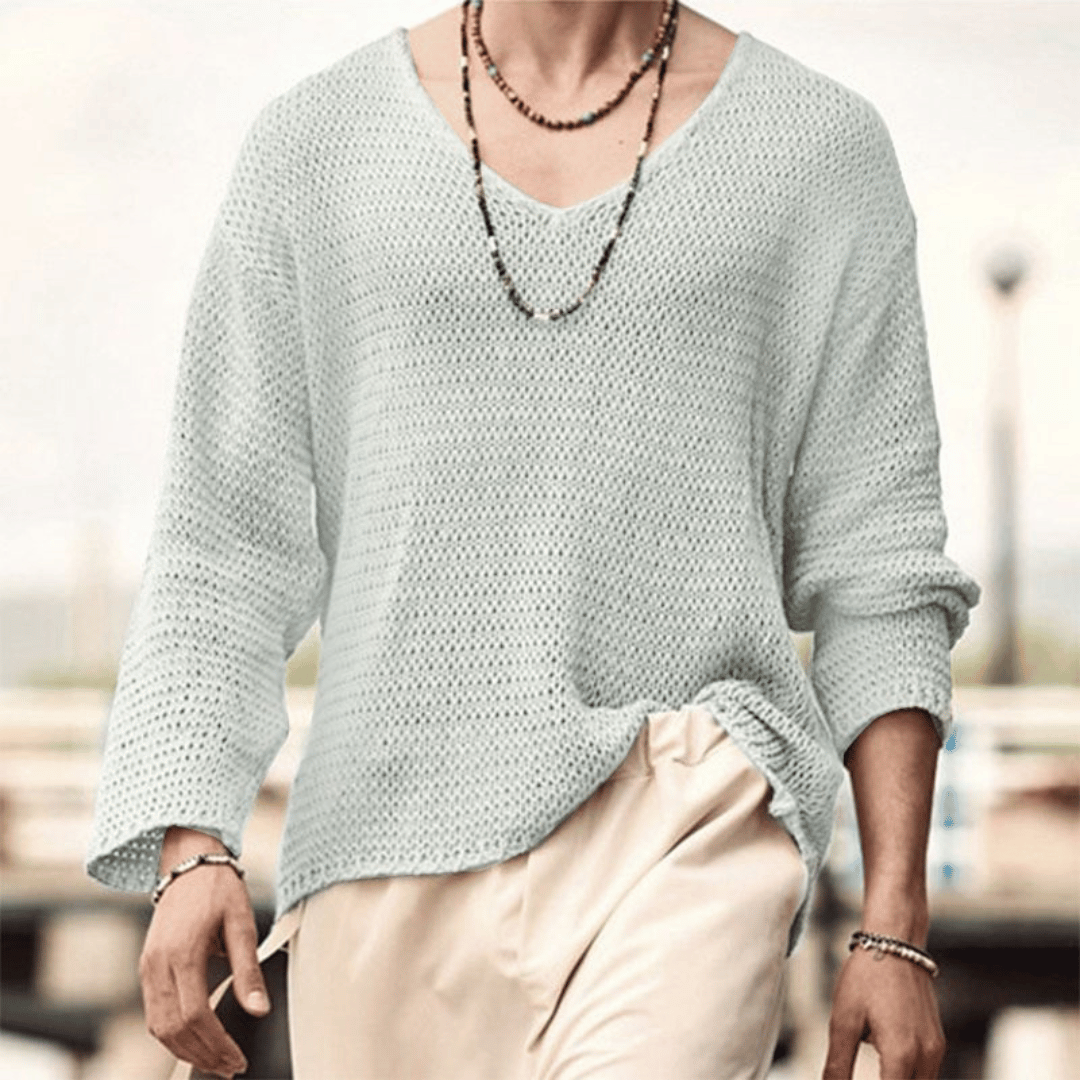 Men's relaxed knit sweater with deep V-neckline, breathable drape, versatile everyday style