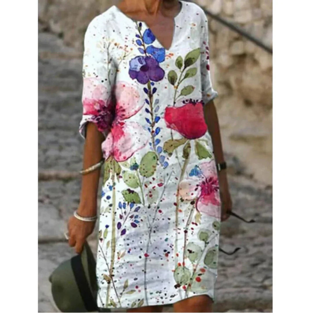 Women's floral midi dress, V-neck, artistic face print with delicate floral accents, sophisticated everyday style