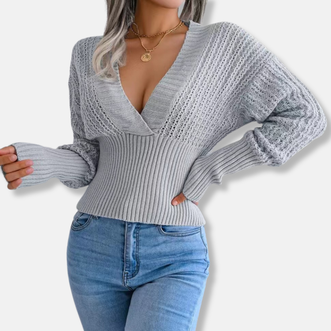 Women's slim fit deep V-neck knitted top with open knit sleeves and ribbed waist detail