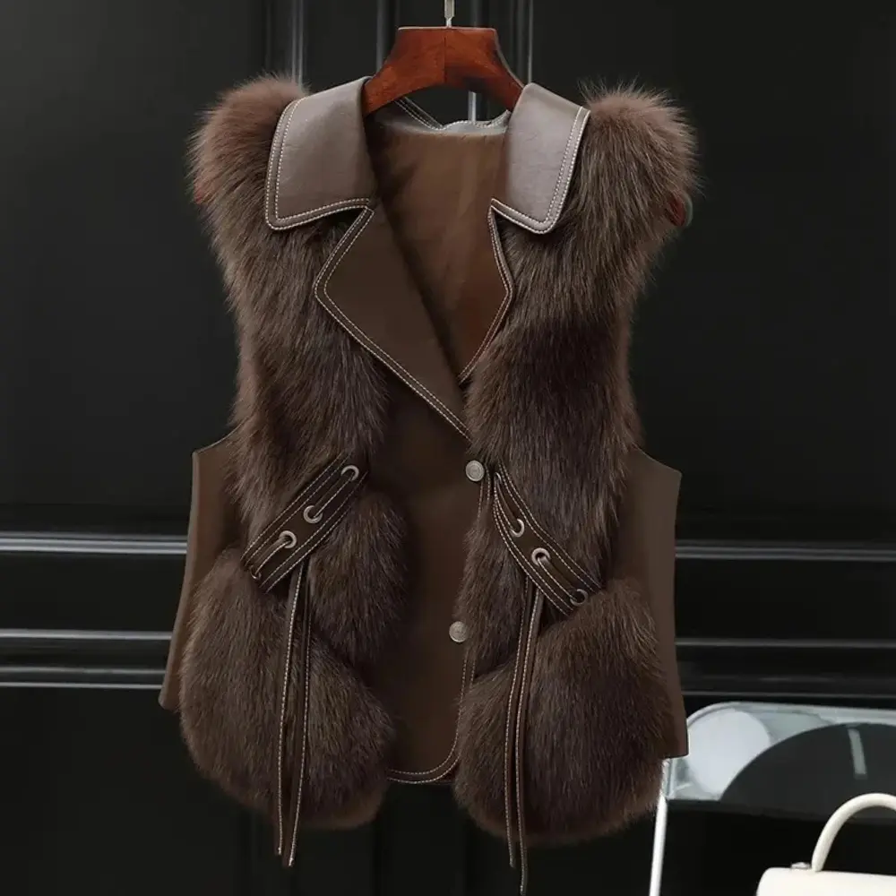 Women's cream faux fur trim sleeveless vest with bold oversized lapel and adjustable side ties