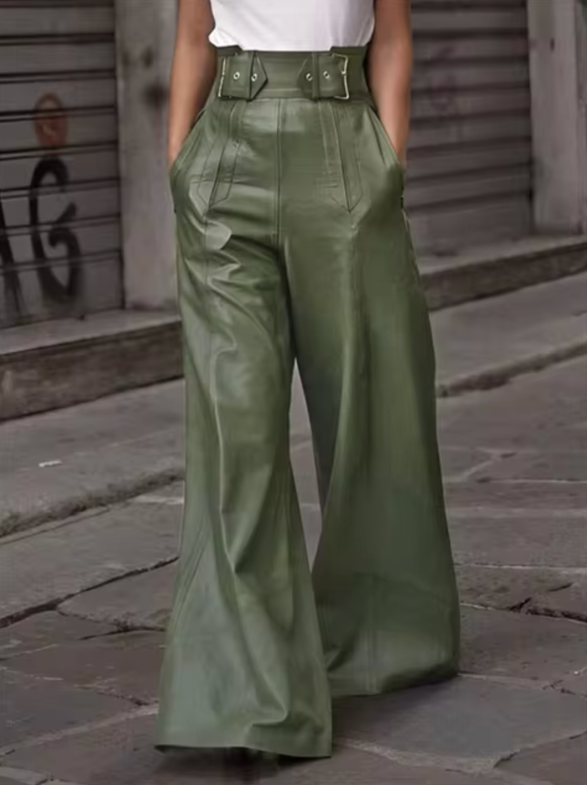 Women's black high-waisted soft leather pleated pants with pockets, elegant streetwear silhouette