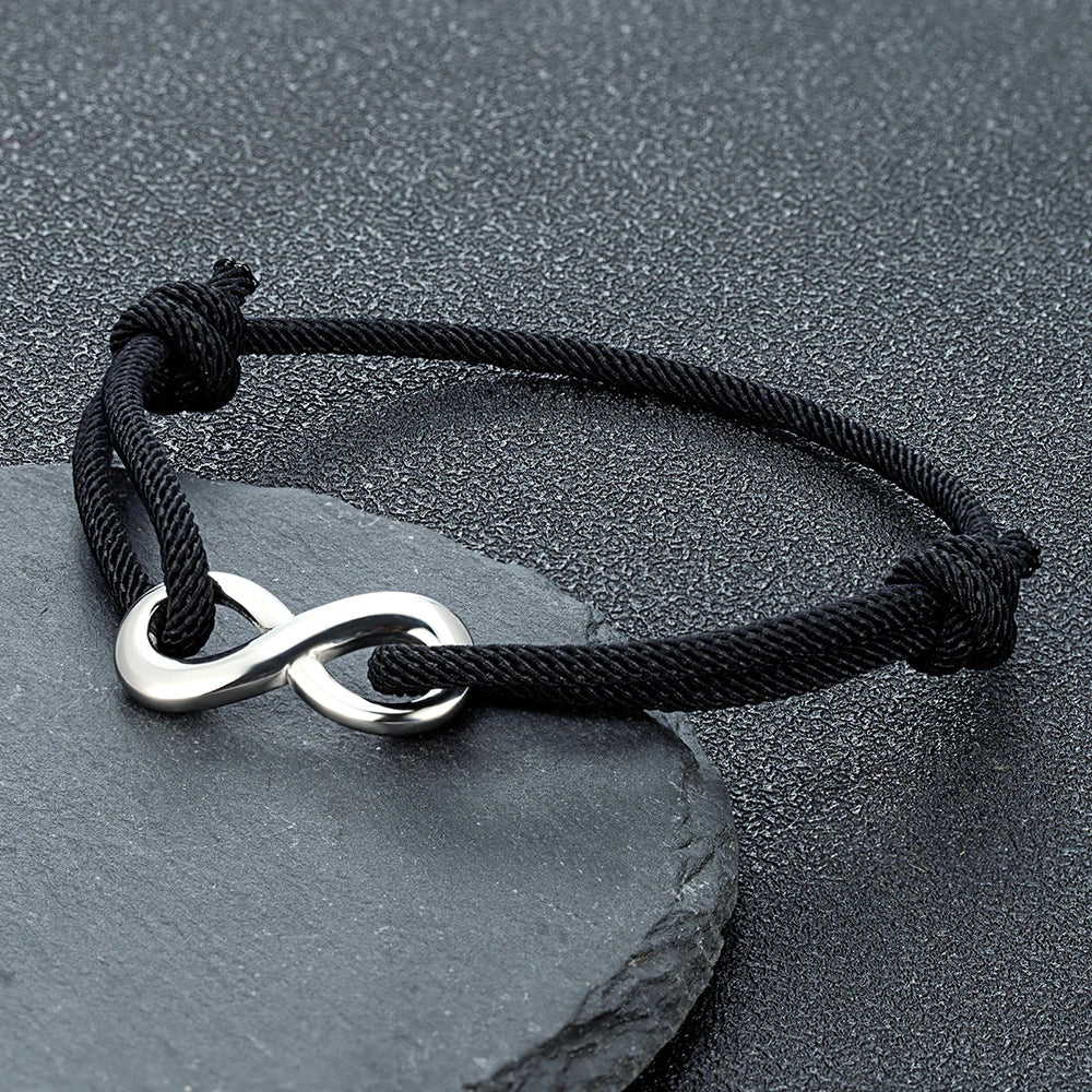 Adjustable braided cord bracelet with stainless steel infinity charm minimalist unisex everyday style