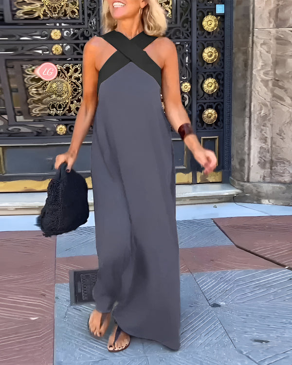 Black halter neck maxi dress with criss-cross neckline, lightweight fabric, effortless summer elegance