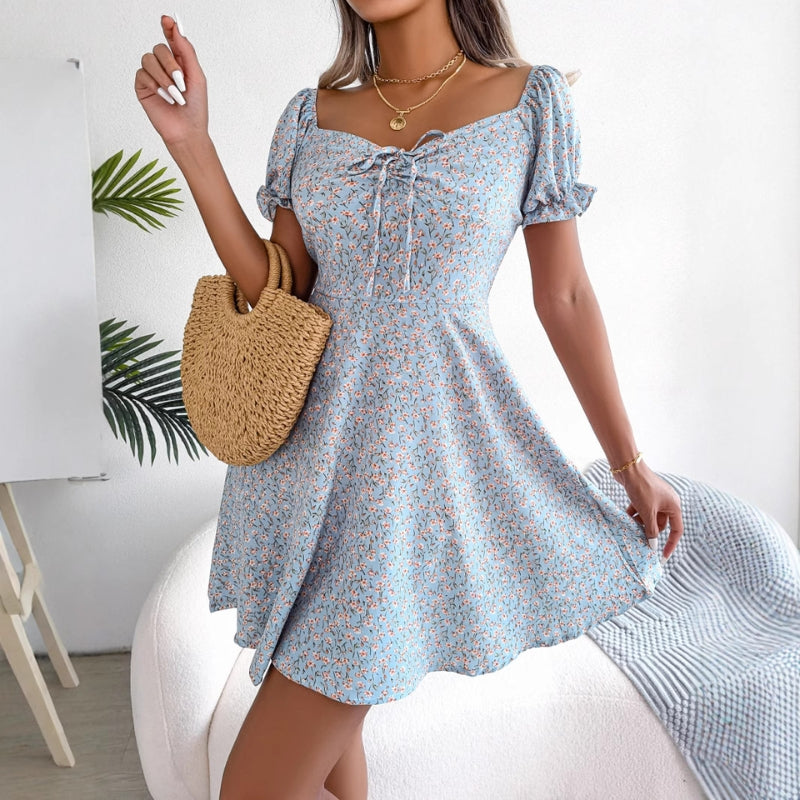 Women's floral midi dress cinched waist flowing hem vintage-inspired silhouette summer style