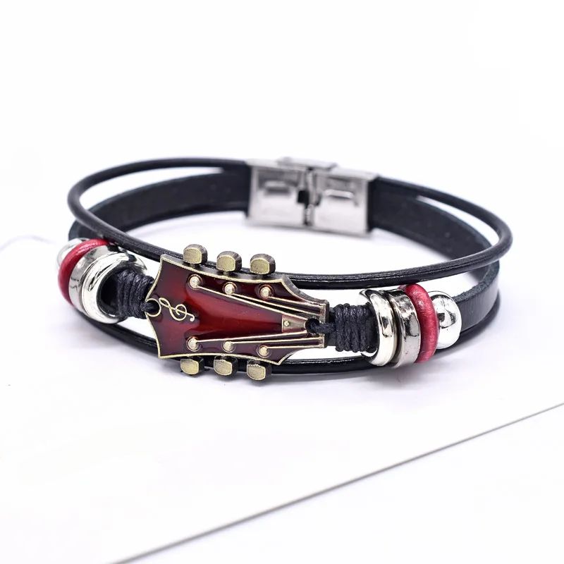 Brown leather guitar bracelet vintage-inspired music accessory with engraved guitar detail