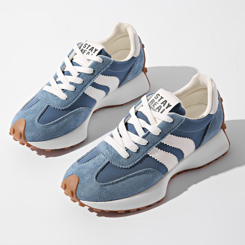 White women's platform lace-up sneakers with chic side stripe detail and height-boosting sole