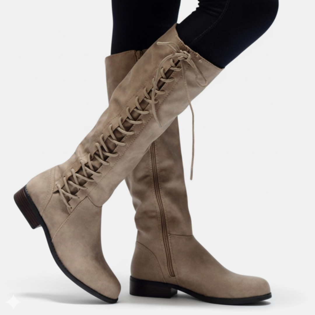 Women's knee-high faux leather boots with criss-cross lace-up detail, block heel, and side zipper