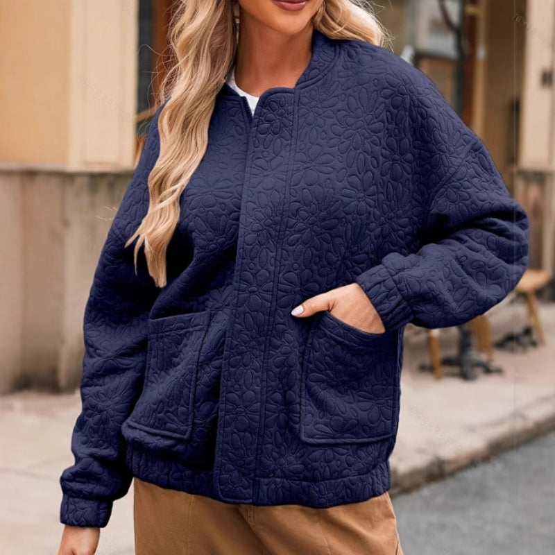 Unisex quilted padded jacket with roomy pockets and easy zip closure for all-season warmth