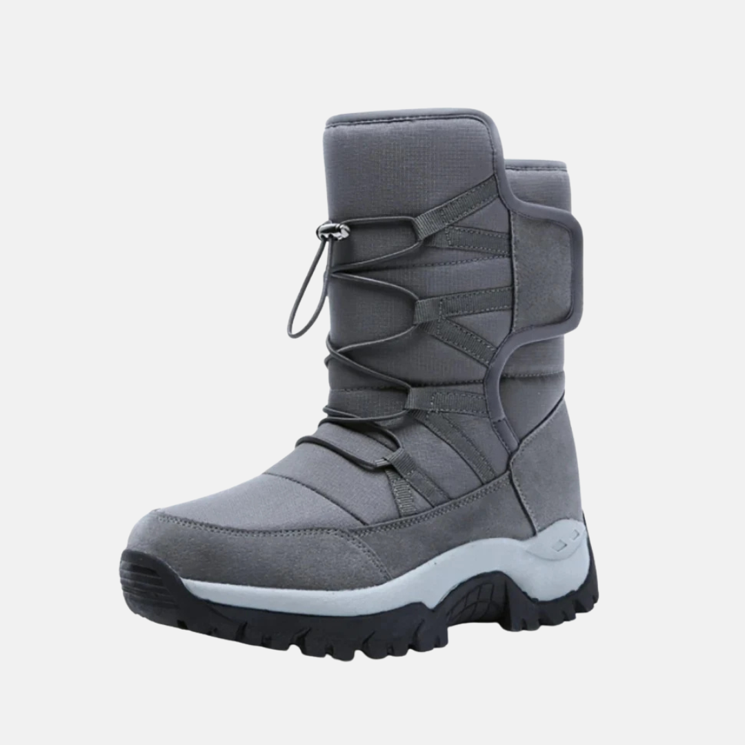 Women's black high-top quilted insulated winter boots with rugged sole for traction and warmth