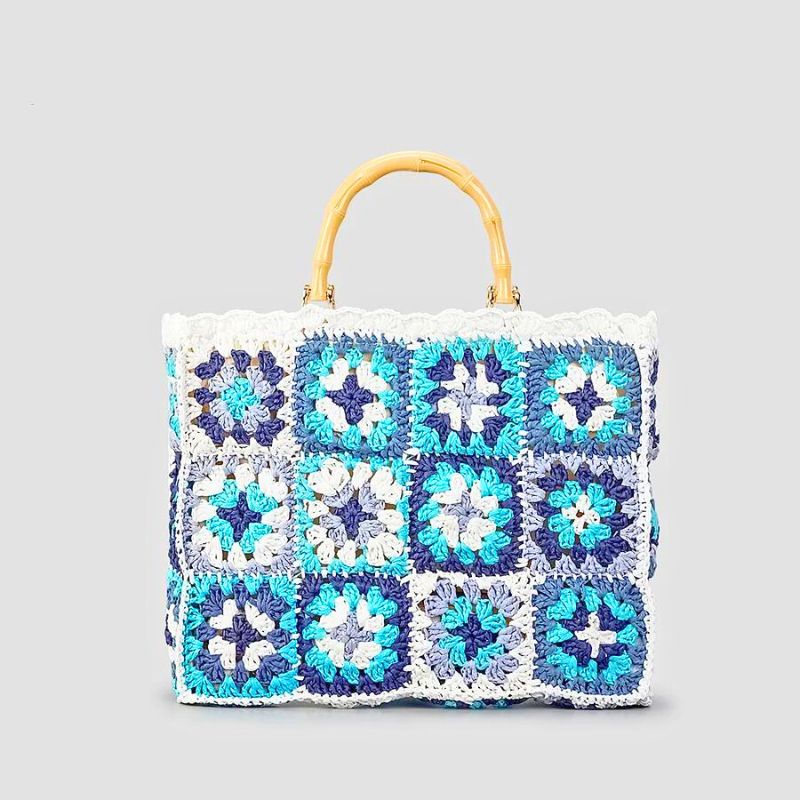 Handmade boho crochet tote bag with woven bamboo handle, eco-friendly sustainable yarn, bohemian style
