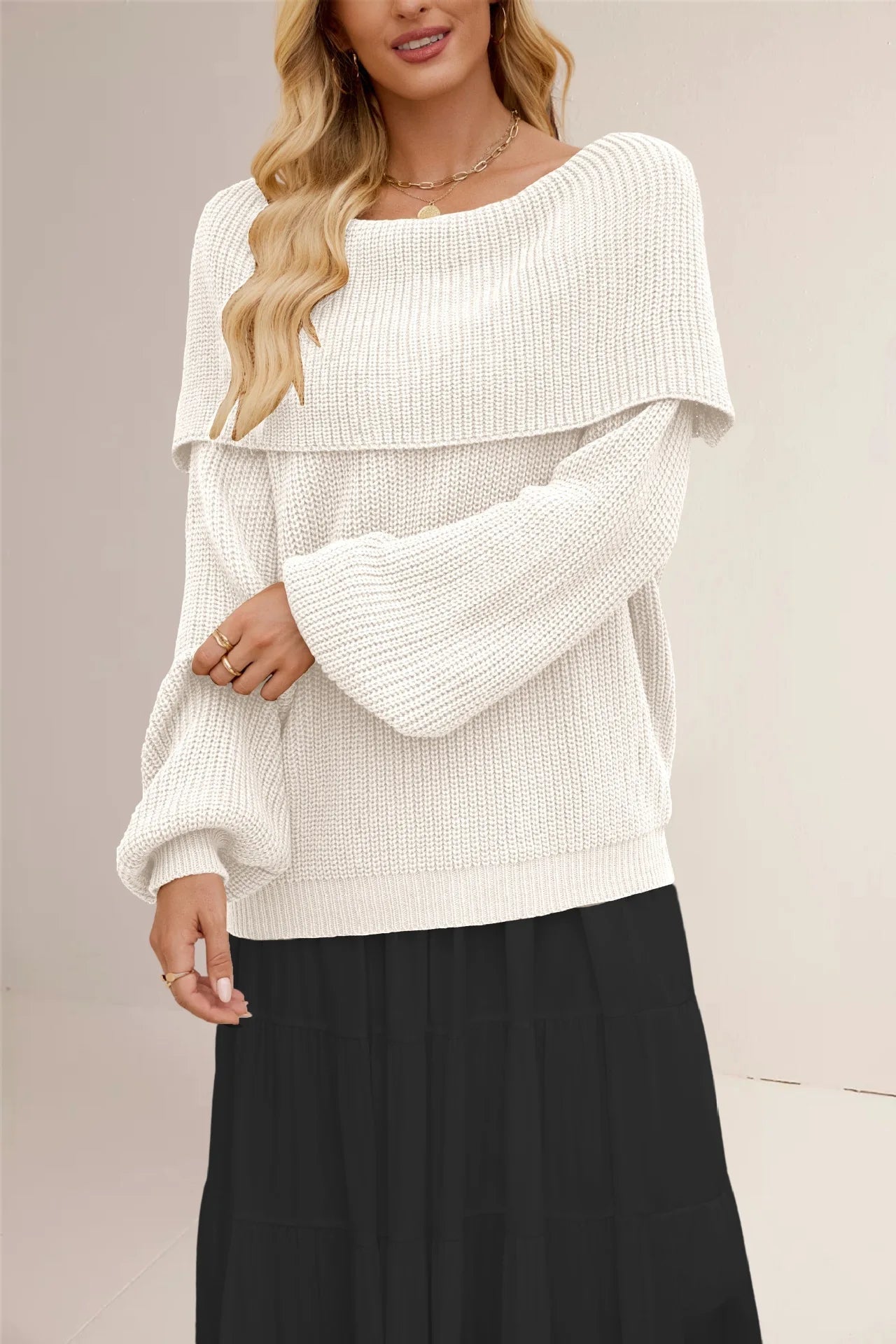 Ivory chunky rib-knit off-shoulder pullover with voluminous sleeves and fold-over collar