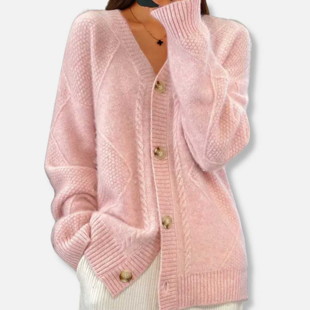 Women's beige cable knit relaxed fit cardigan with button front closure and hip length silhouette