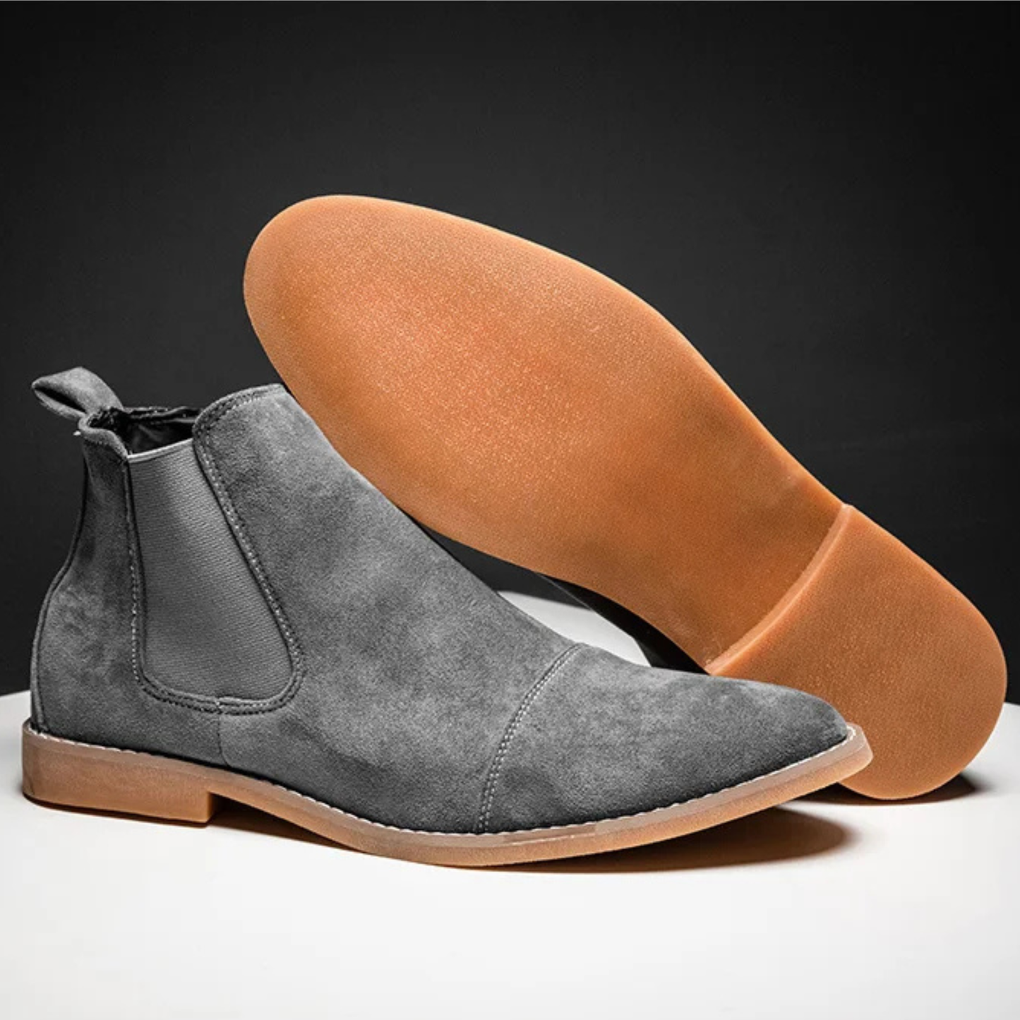 Men's tan suede Chelsea boots with elastic panels, polished dress-casual style and flat rubber sole