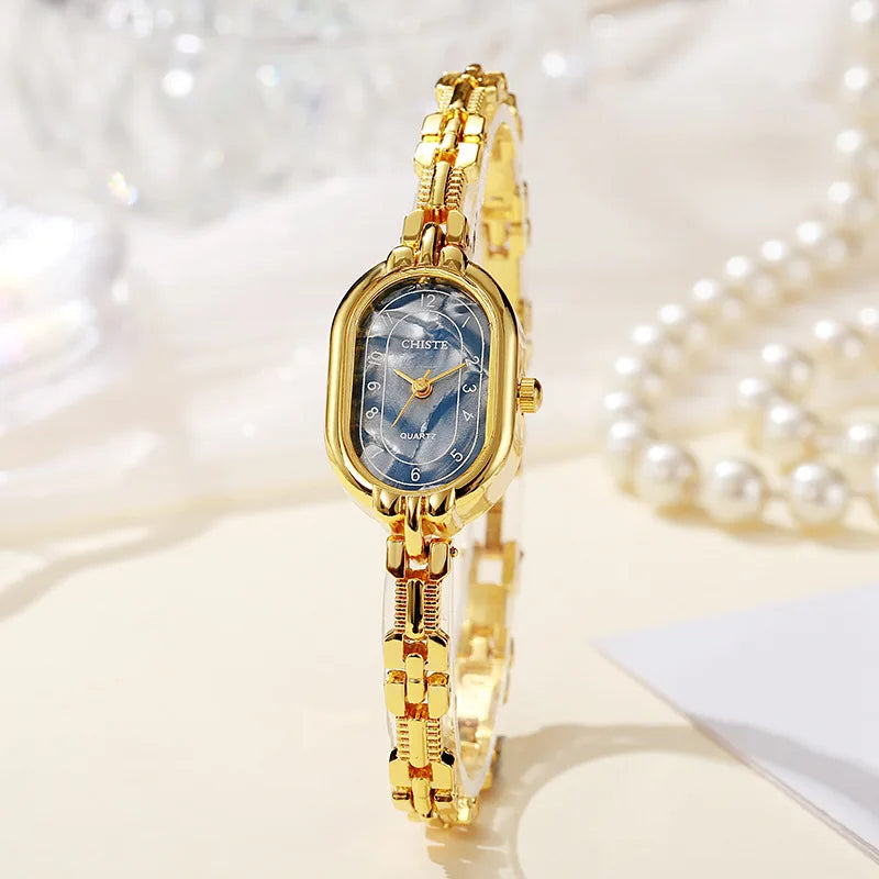Empress oval quartz women's watch gold chain-link bracelet champagne dial crystal markers