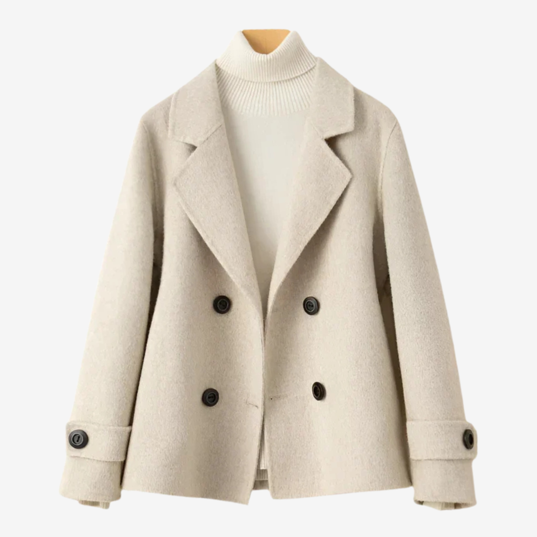 Short double-breasted women's coat with notched collar in refined style for modern everyday chic