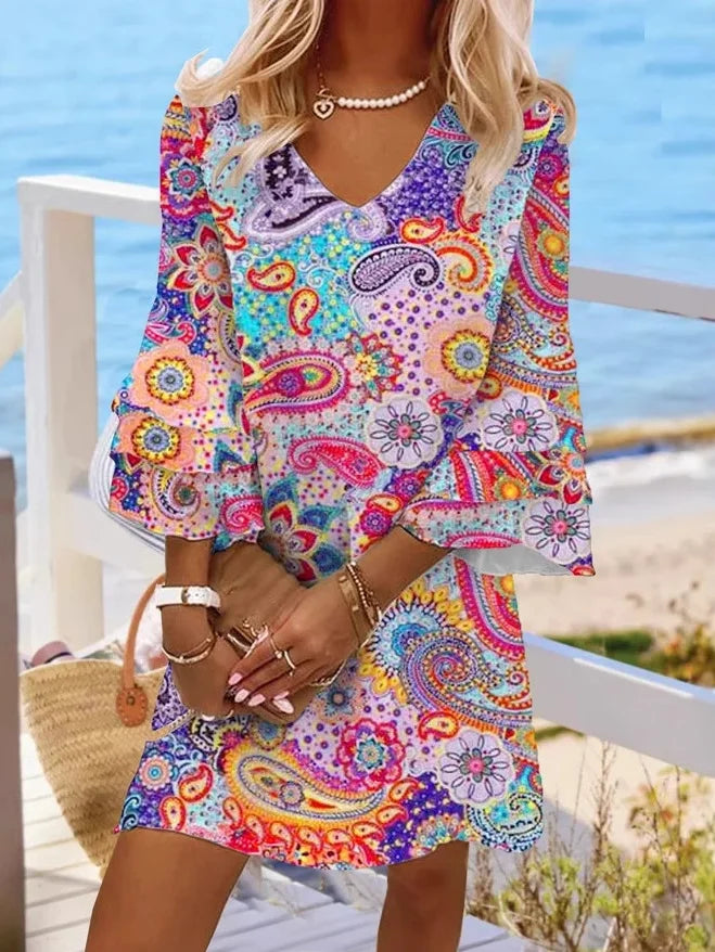 Women's bold allover print V-neck mini dress with loose silhouette and above-the-knee length