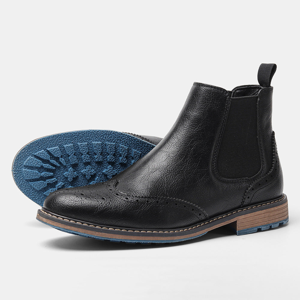 Men's brown leather Chelsea boots with brogue toe perforations, elastic sides, sleek timeless silhouette