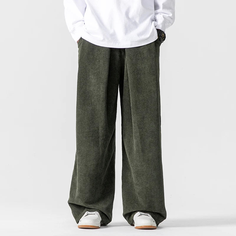 Women's brown corduroy wide-leg trousers with drawstring waist, relaxed 90s vintage silhouette