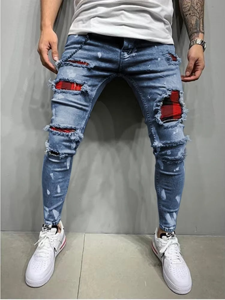 Rebel distressed tapered denim pants with premium stretch fabric and bold layered distressing for streetwear