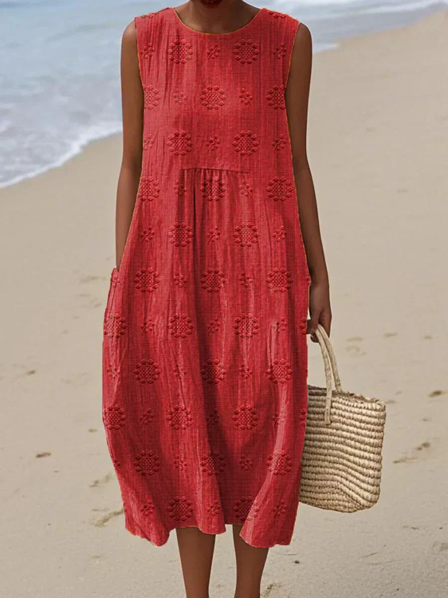 Women's sleeveless textured midi dress with gathered waist, circular print motifs, lightweight breezy beach style