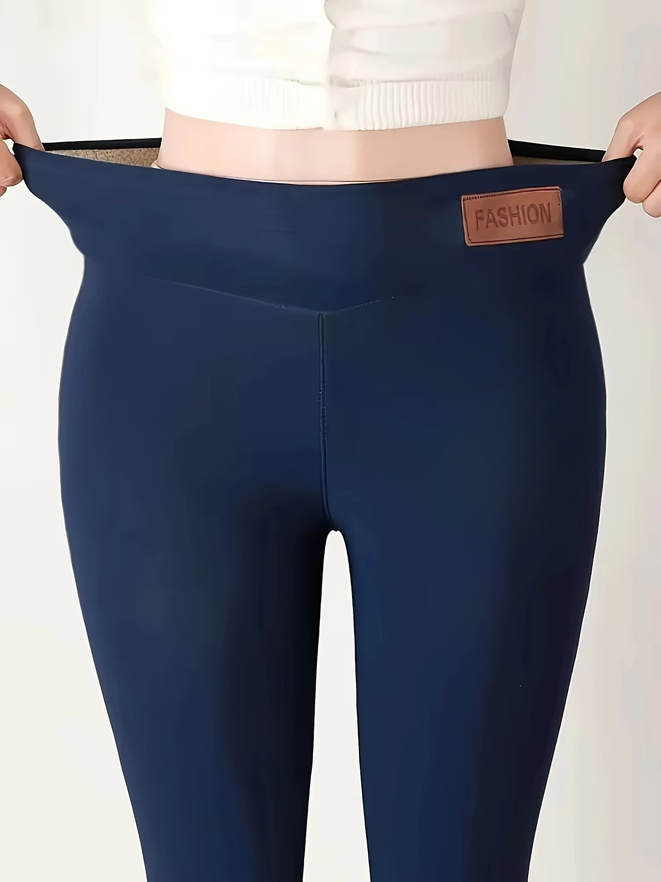 Women's black fleece-lined high-waist thermal leggings with plush interior for cold weather comfort