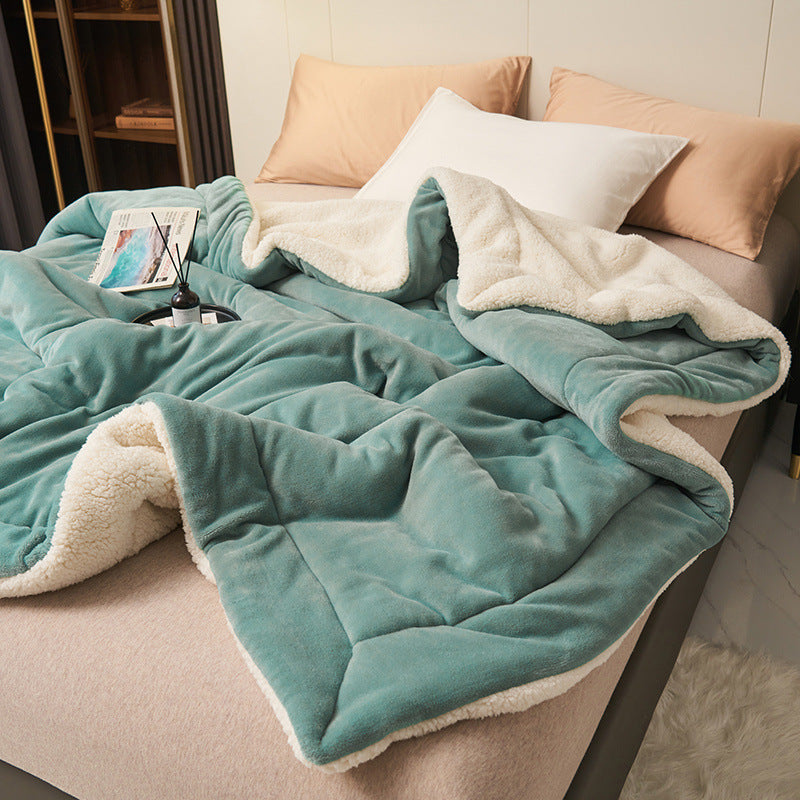 Reversible sherpa flannel throw blanket in cozy neutral tones with dual-texture plush design for ultimate warmth