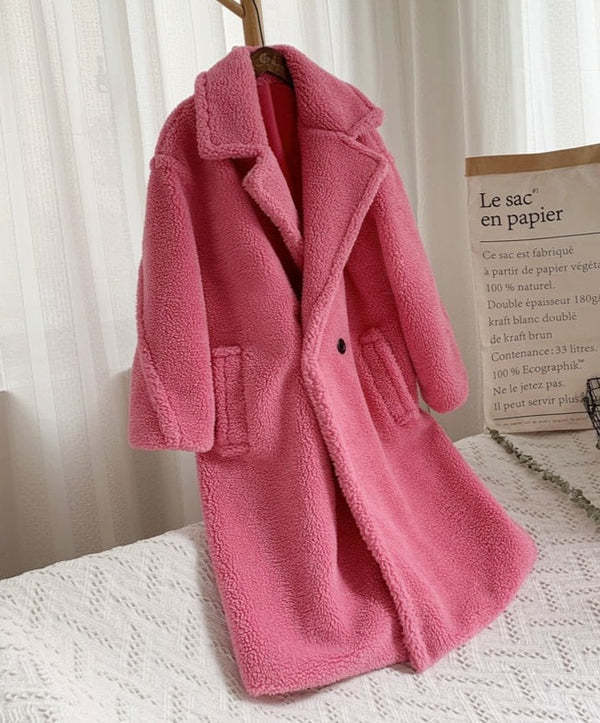 Women's ivory faux fur coat with lapel collar, plush texture, and side pockets for cozy warmth