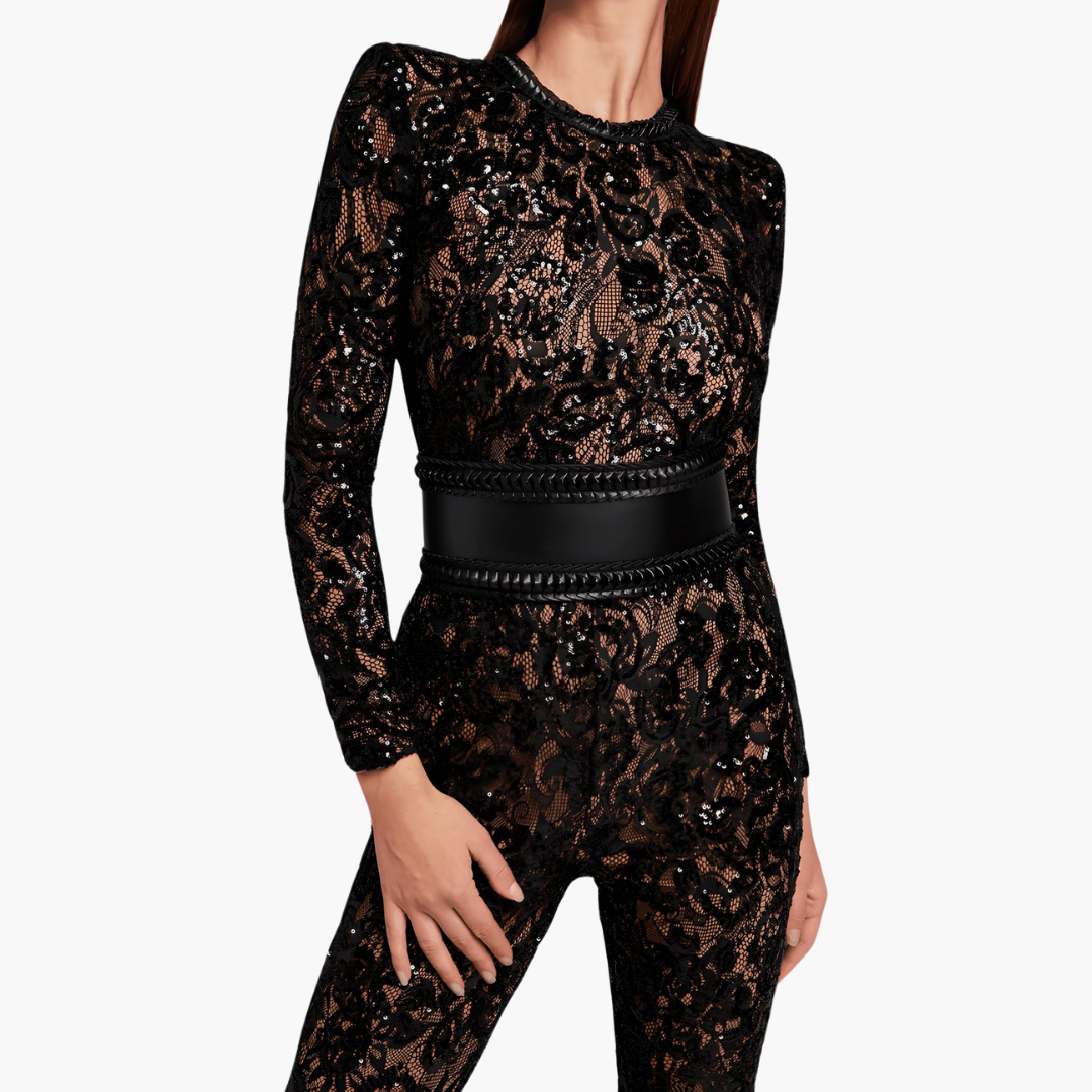 Women's black long sleeve flared jumpsuit with elegant one-piece silhouette and modern evening style