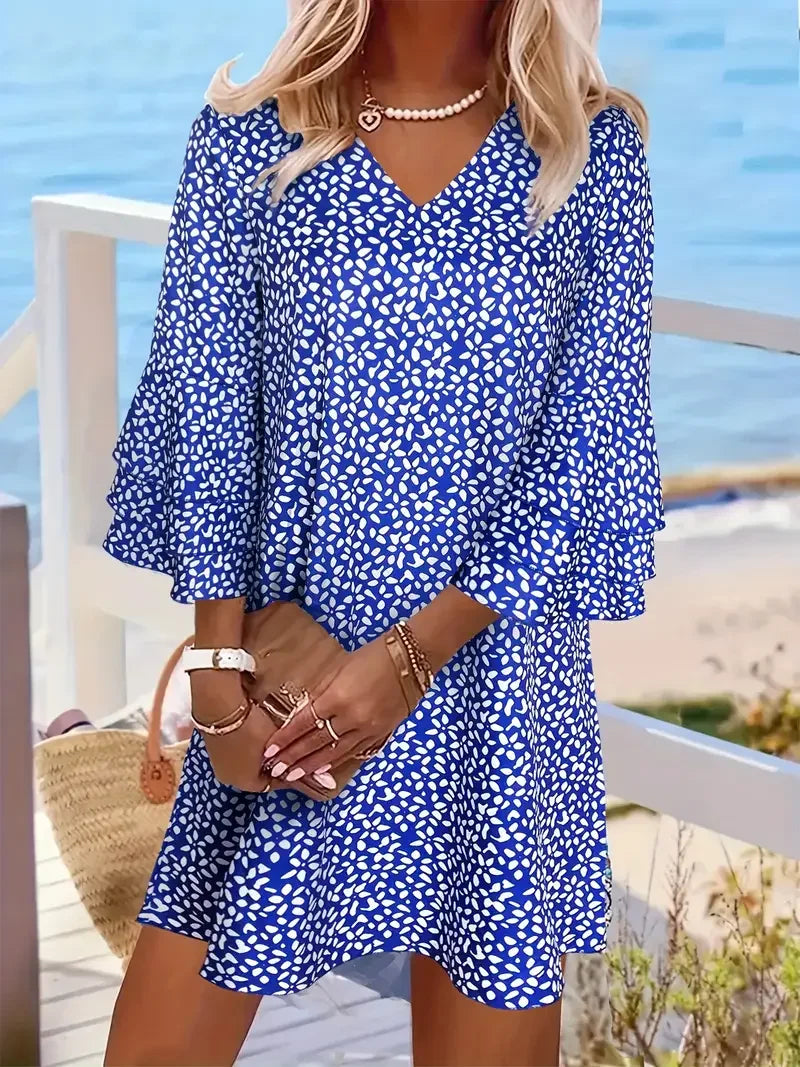 Women's bold allover print V-neck mini dress with loose silhouette and above-the-knee length