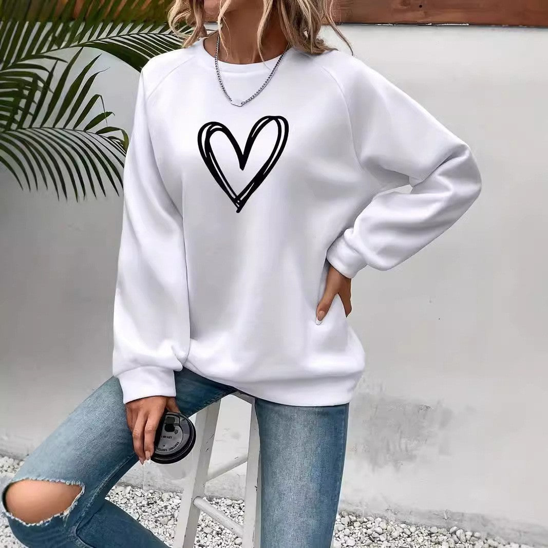 Women's pink heart print crew neck sweatshirt, cozy long sleeve pullover with cute heart motif