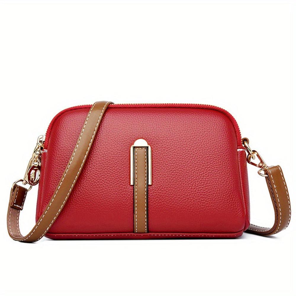 Elaine black vegan leather crossbody bag with gold-tone zipper adjustable strap compact chic