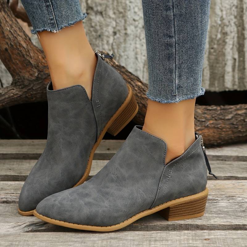 Women's casual slip-on ankle boots with low block heel and side openings for effortless everyday style