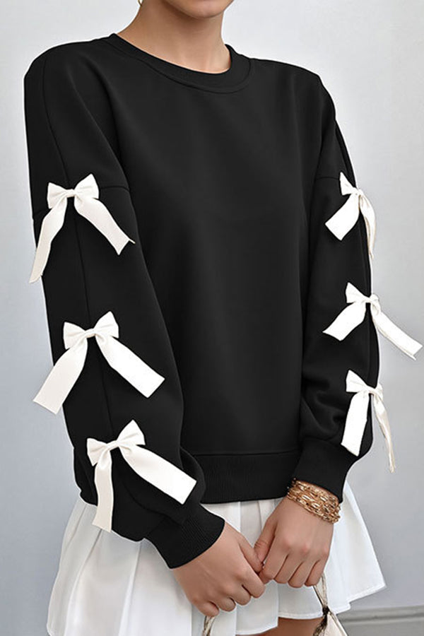 Women's loose hip-length sweatshirt with festive Christmas bow embroidery, round neck, cozy casual winter style