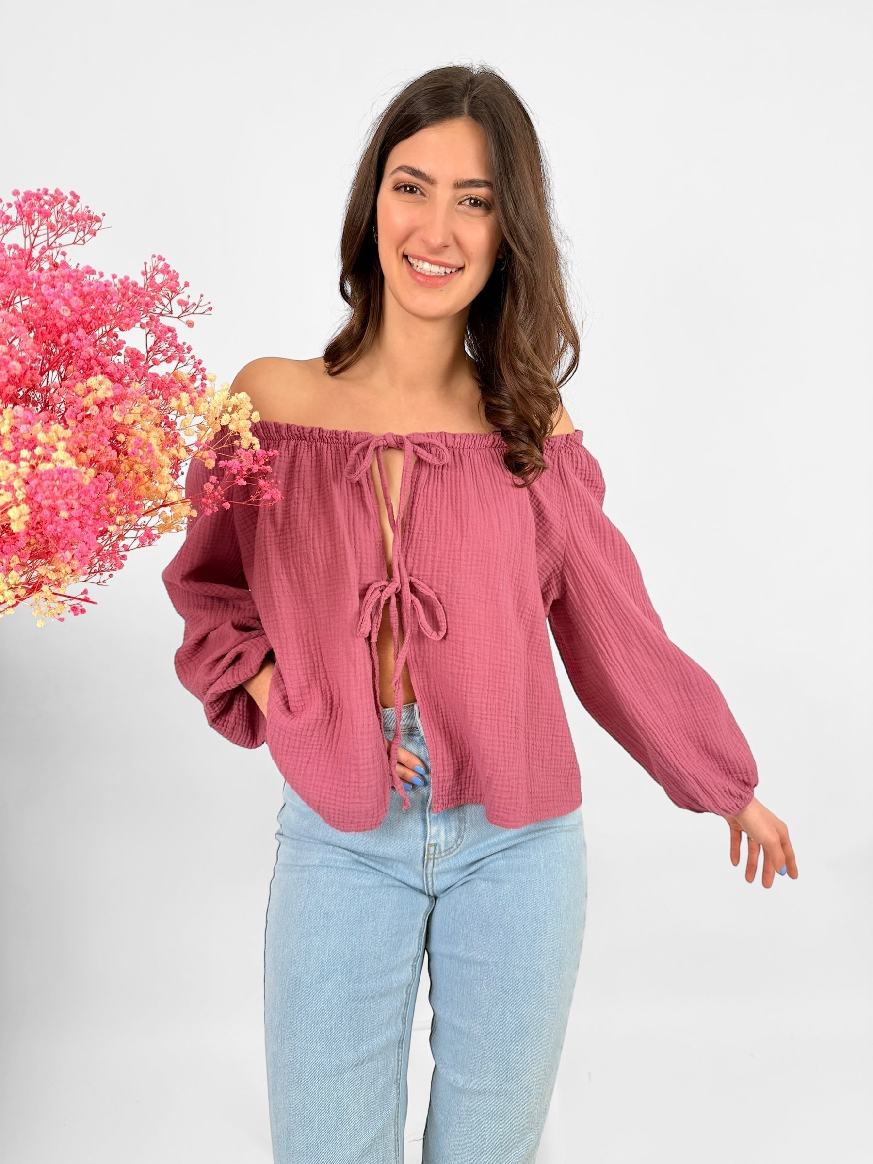 Lightweight women's muslin blouse with delicate bow accents, breathable feminine everyday top