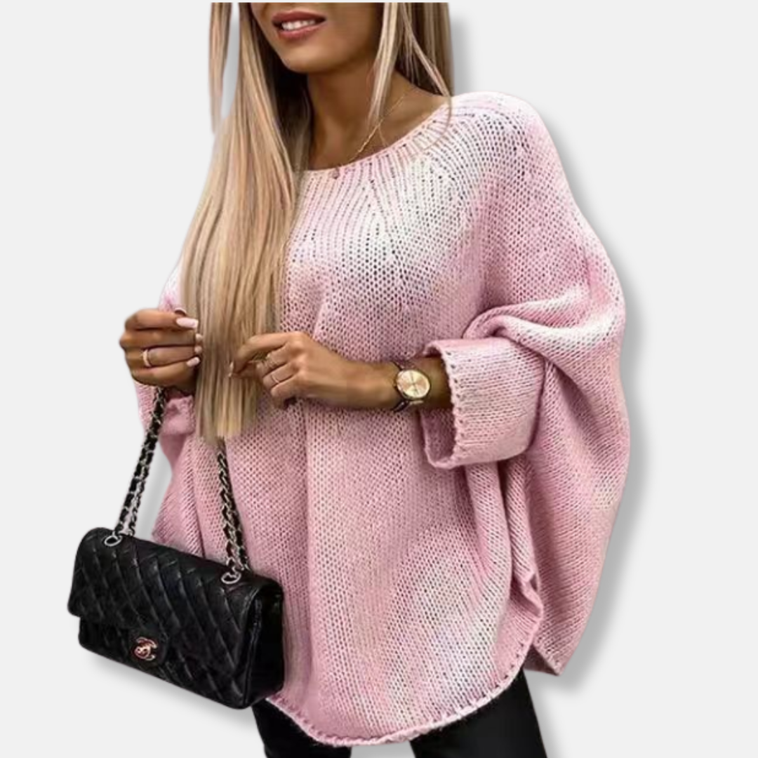 Women's chunky knit oversized tunic sweater in neutral tones with wide batwing sleeves