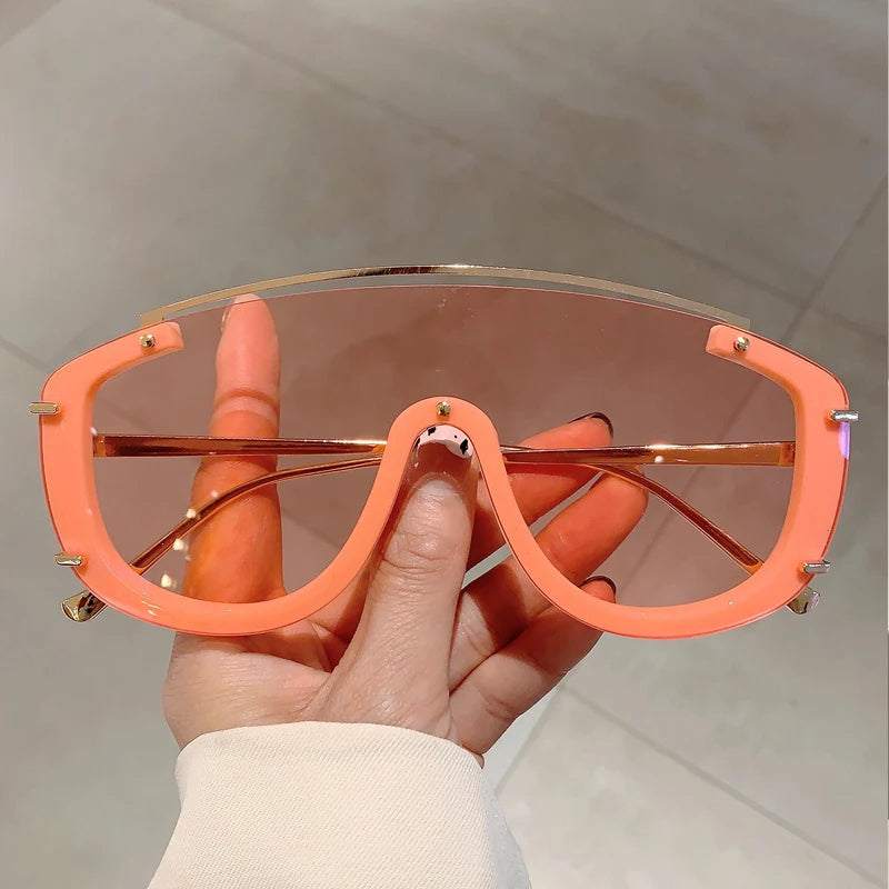 Eclipse oversized visor sunglasses shield-style frame gold-tone accents avant-garde bold fashion shades