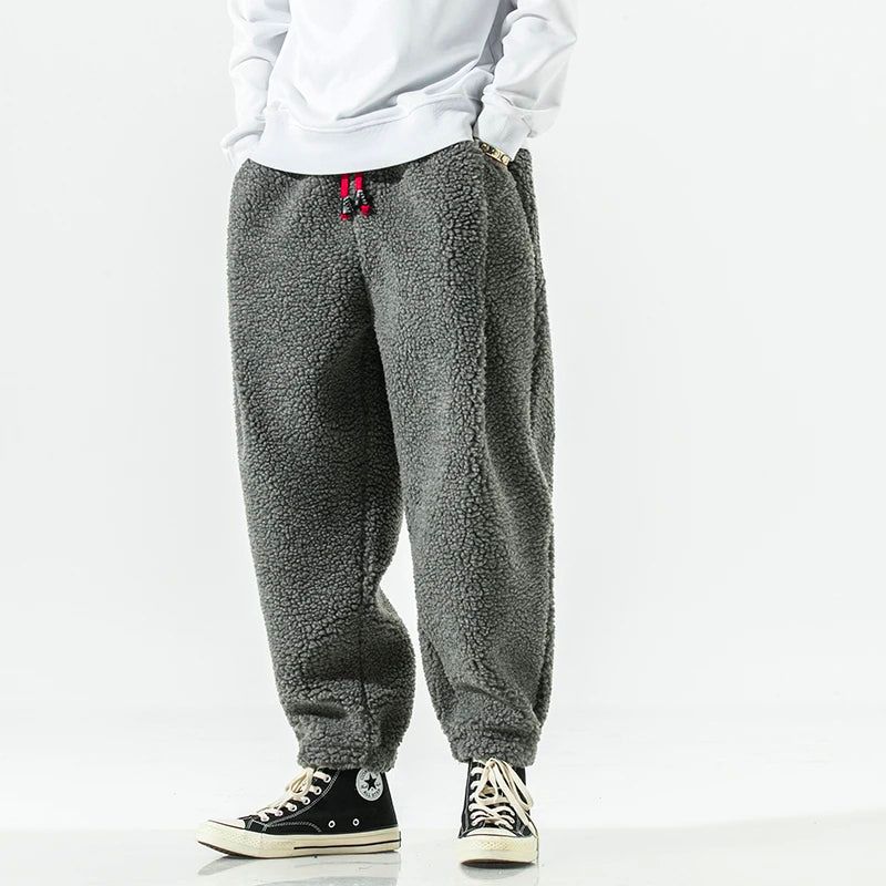 Thick lamb wool relaxed-fit winter pants in neutral tone, soft finish for all-day cold weather comfort