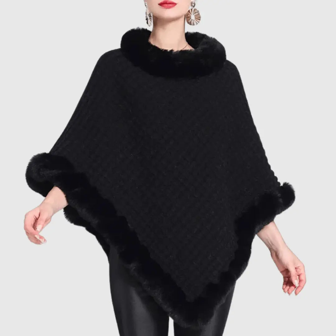 Women's chunky cable-knit poncho with faux fur trim, cozy oversized style in soft neutral tones